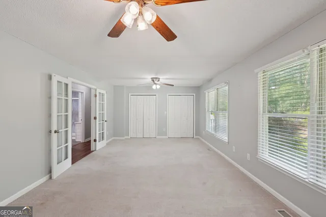 a view of an empty room with a window