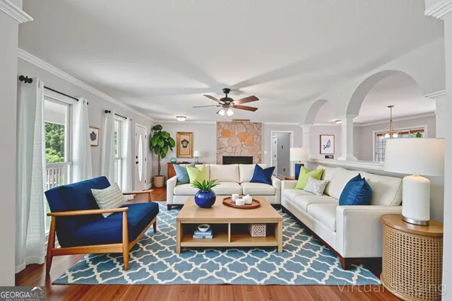 a living room with furniture and a rug