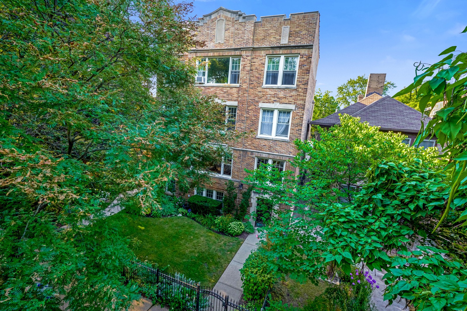 2018 West Greenleaf Avenue, Unit 1F Chicago, IL 60645 - Photo 12 of 12 front view of a house with a yard