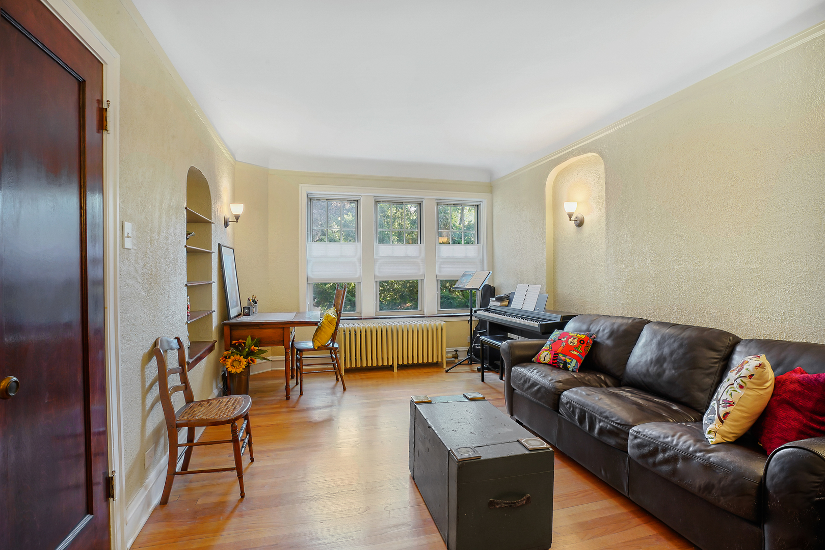 2018 West Greenleaf Avenue, Unit 1F Chicago, IL 60645 - Photo 5 of 12 a living room with furniture and a window
