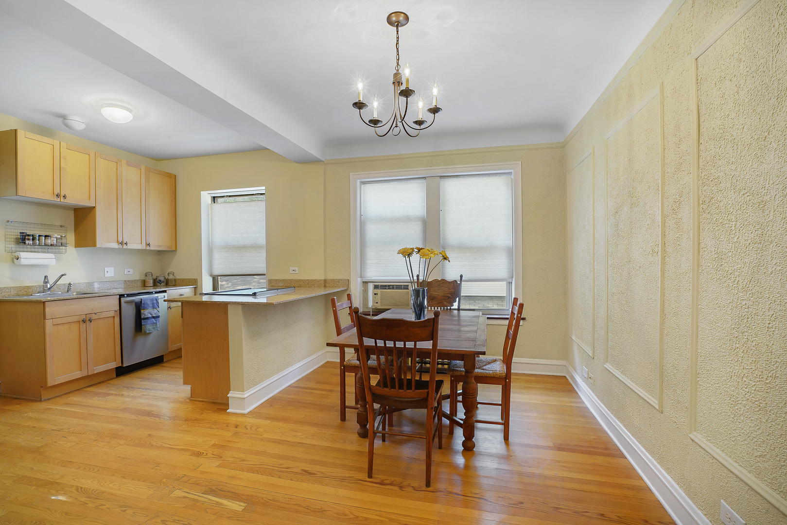 2018 West Greenleaf Avenue, Unit 1F Chicago, IL 60645 - Photo 7 of 12 a view of a dining room with furniture window and wooden floor