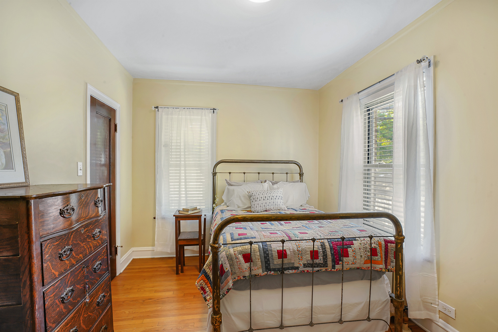 2018 West Greenleaf Avenue, Unit 1F Chicago, IL 60645 - Photo 10 of 12 a bedroom with a bed and a window