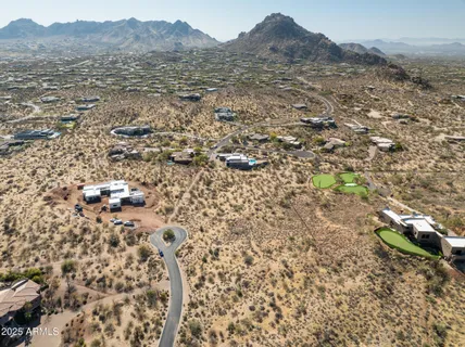 a bathroom with a toilet and a shower curtain