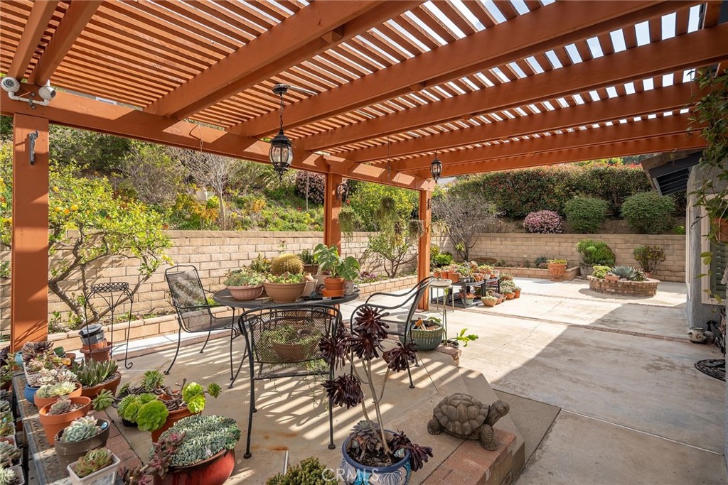 23419 Sandridge Road Diamond Bar, CA 91765 - Photo 12 of 51 a view of a patio with table and chairs and potted plants