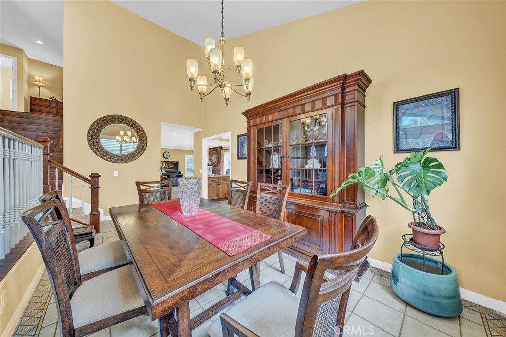 23419 Sandridge Road Diamond Bar, CA 91765 - Photo 22 of 51 a dining room with furniture a chandelier and wooden floor