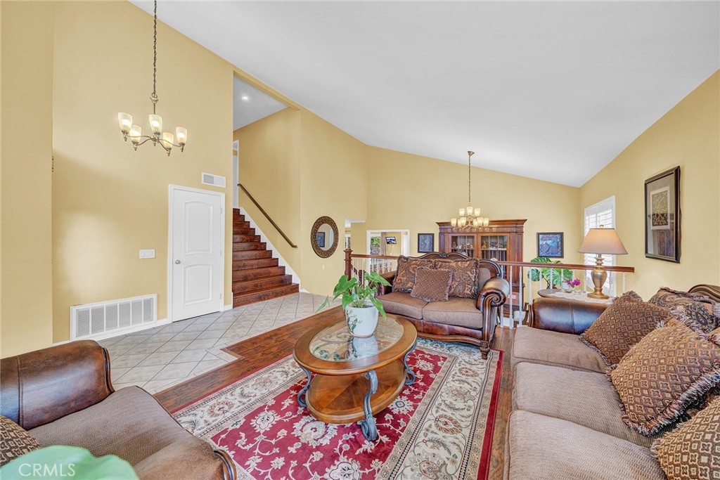 23419 Sandridge Road Diamond Bar, CA 91765 - Photo 23 of 51 a living room with furniture and a chandelier