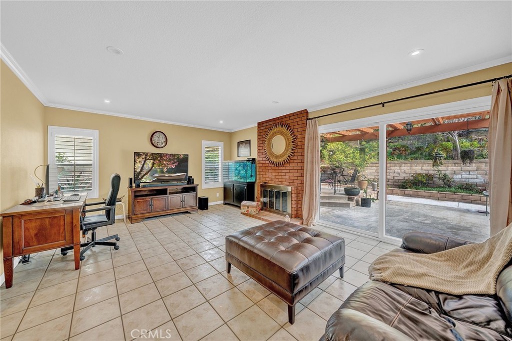 23419 Sandridge Road Diamond Bar, CA 91765 - Photo 24 of 51 a living room with fireplace furniture and a floor to ceiling window