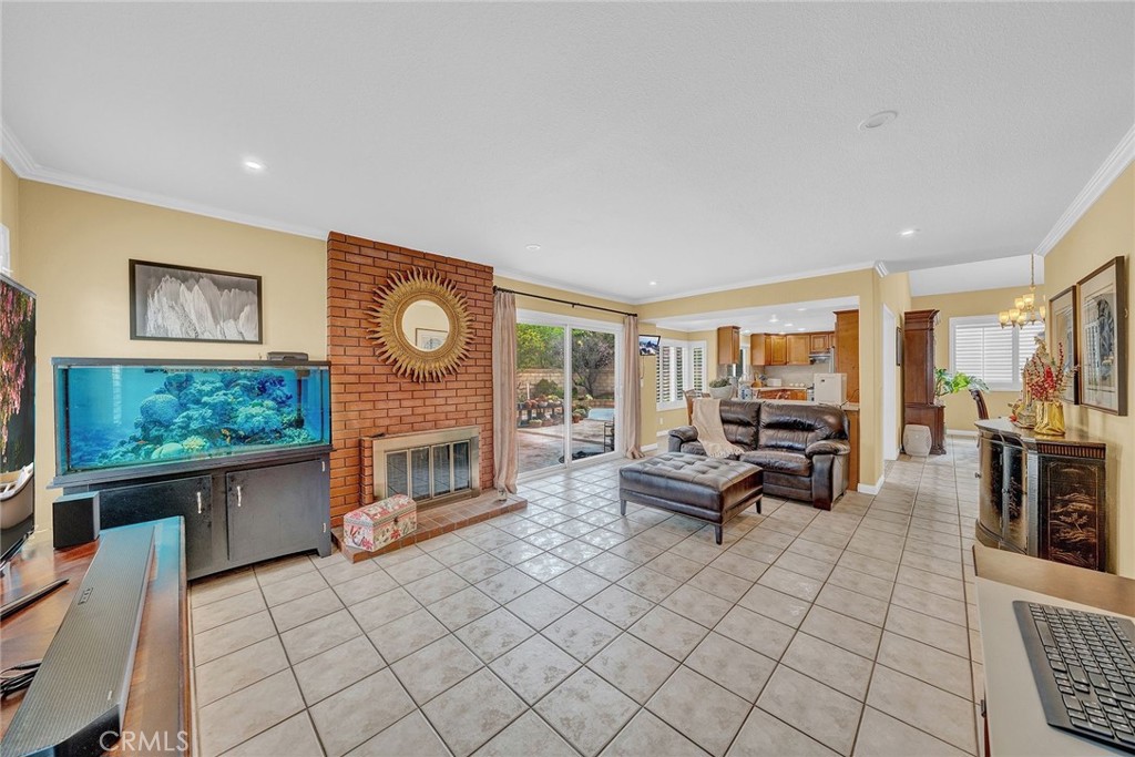 23419 Sandridge Road Diamond Bar, CA 91765 - Photo 26 of 51 a living room with furniture a flat screen tv and floor to ceiling window