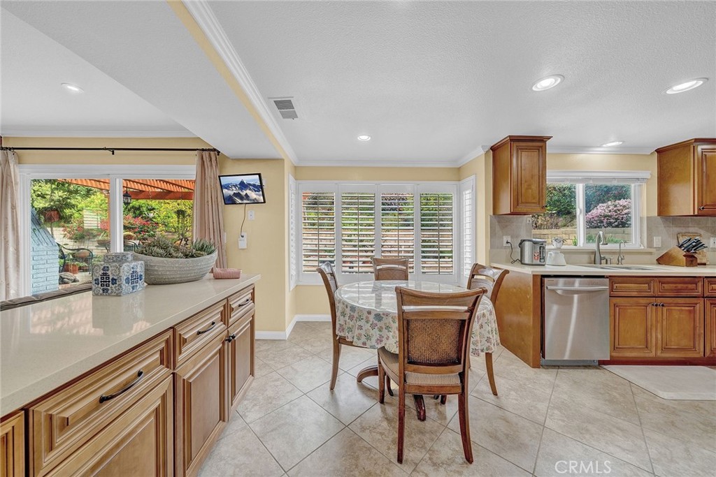 23419 Sandridge Road Diamond Bar, CA 91765 - Photo 30 of 51 a dining room with granite countertop furniture a large window and a sink