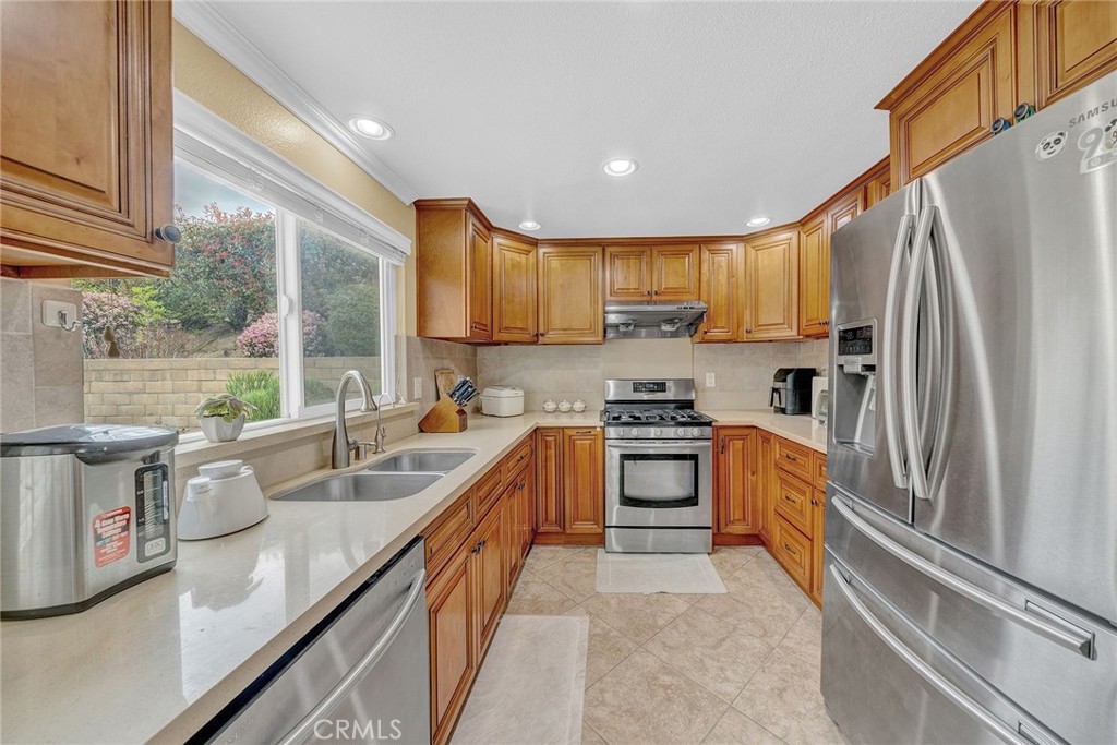 23419 Sandridge Road Diamond Bar, CA 91765 - Photo 31 of 51 a kitchen with a sink appliances cabinets and a window