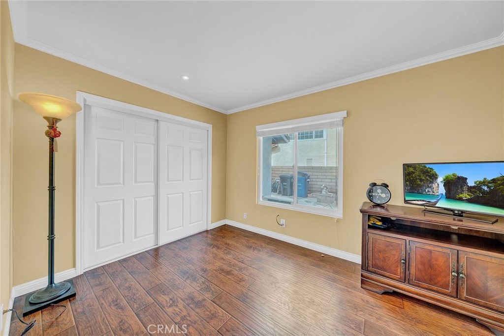 23419 Sandridge Road Diamond Bar, CA 91765 - Photo 35 of 51 a view of an empty room with wooden floor and a window