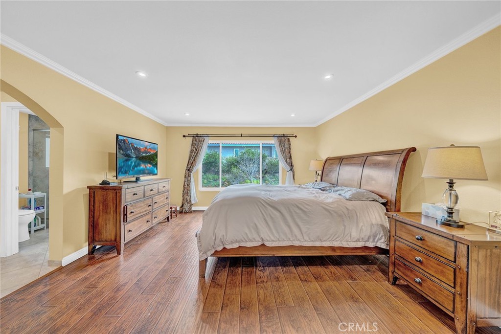 23419 Sandridge Road Diamond Bar, CA 91765 - Photo 39 of 51 a spacious bedroom with a bed and a flat screen tv