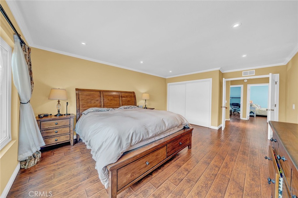 23419 Sandridge Road Diamond Bar, CA 91765 - Photo 40 of 51 a bedroom with a bed and wooden floor