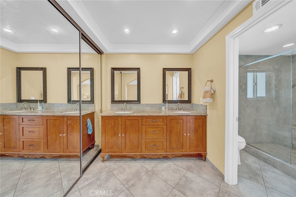 23419 Sandridge Road Diamond Bar, CA 91765 - Photo 44 of 51 a spacious bathroom with a granite countertop sink and a mirror