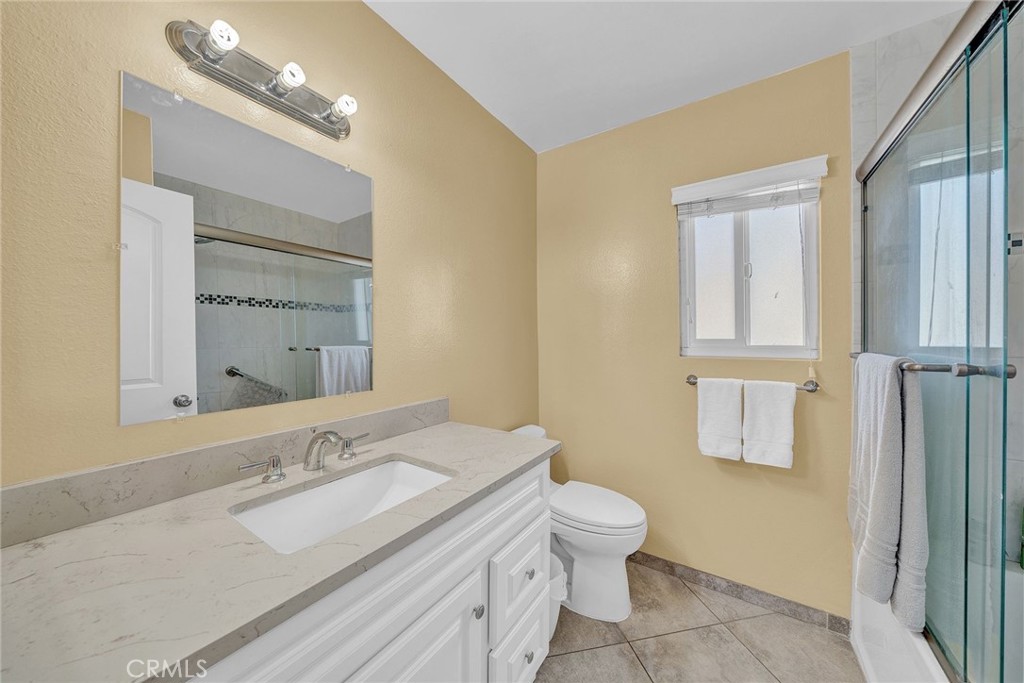 23419 Sandridge Road Diamond Bar, CA 91765 - Photo 48 of 51 a bathroom with a granite countertop sink toilet and shower