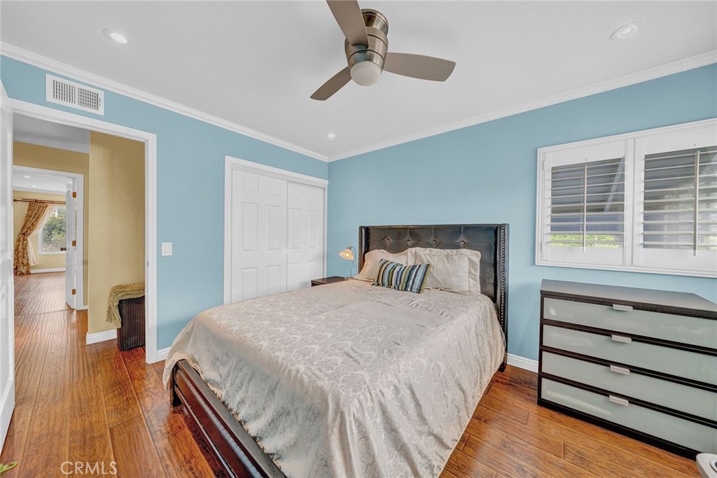 23419 Sandridge Road Diamond Bar, CA 91765 - Photo 50 of 51 a bedroom with a bed and wooden floor