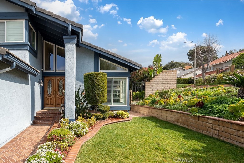 23419 Sandridge Road Diamond Bar, CA 91765 - Photo 5 of 51 a front view of a house with a yard
