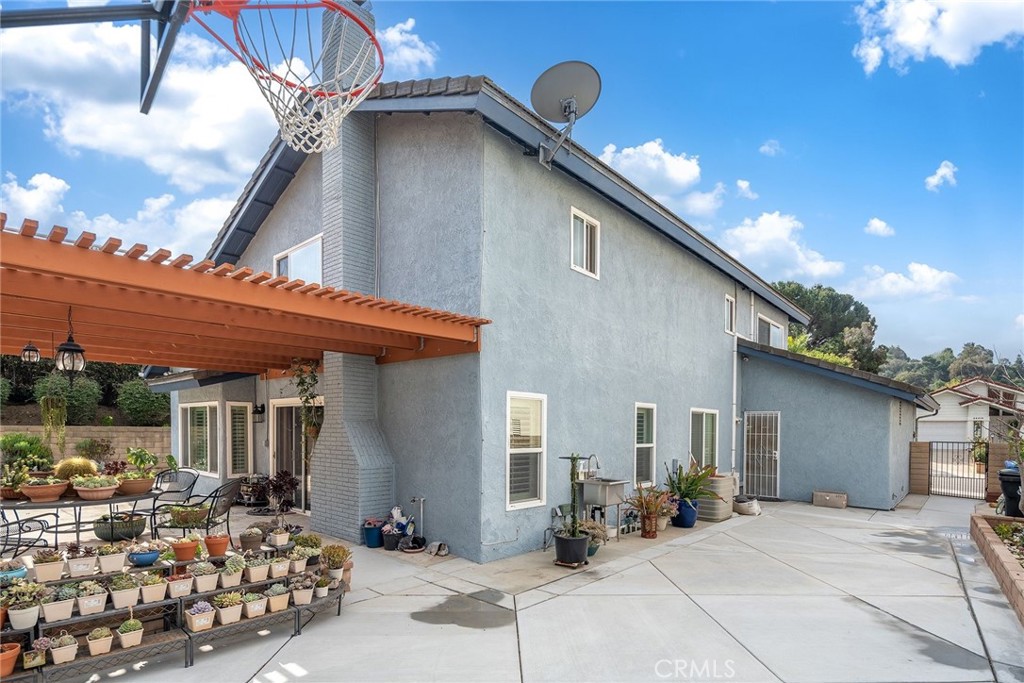 23419 Sandridge Road Diamond Bar, CA 91765 - Photo 8 of 51 a backyard of a house with outdoor seating and barbeque oven