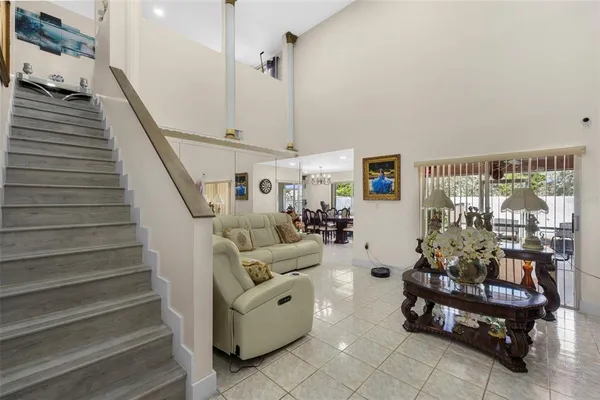 a living room with furniture and a large window