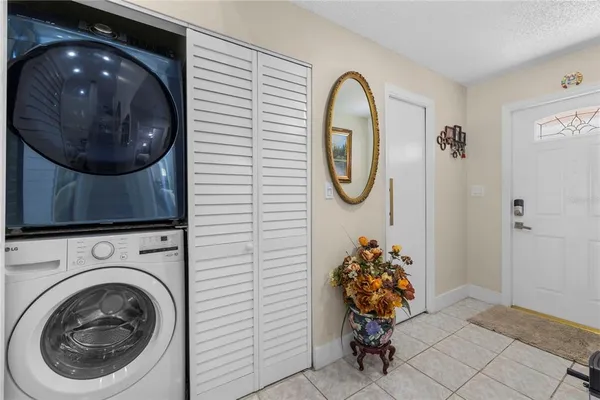 a bathroom with a sink mirror and vanity