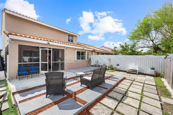 a backyard of a house with seating space
