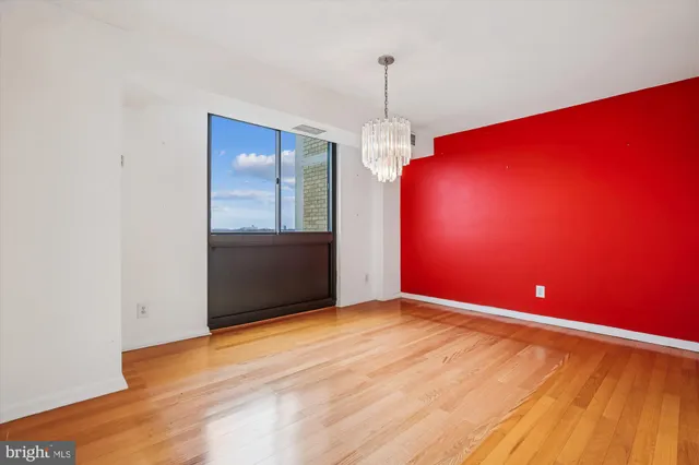 wooden floor in an empty room with windows