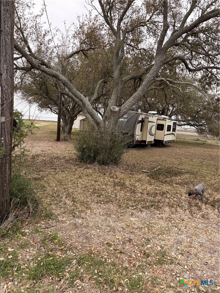14 Pelican Point Avenue Port Lavaca, TX 77979 - Photo 2 of 9 a view of a car in front of a road