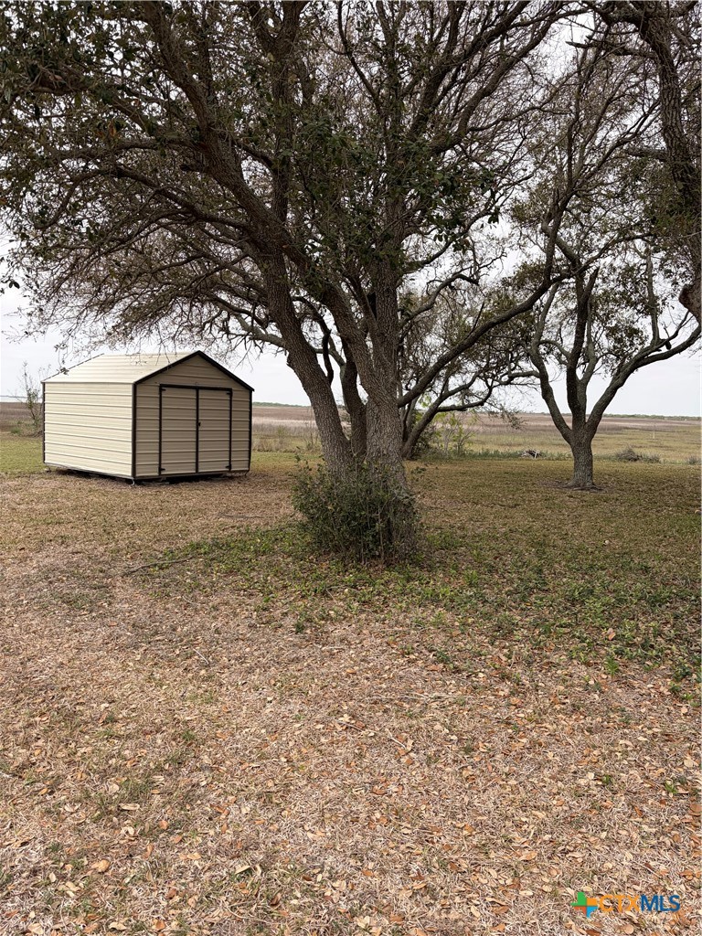 14 Pelican Point Avenue Port Lavaca, TX 77979 - Photo 4 of 9 a large tree in front of a white house