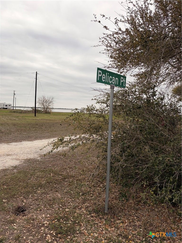 14 Pelican Point Avenue Port Lavaca, TX 77979 - Photo 6 of 9 a street sign on a pole on a road