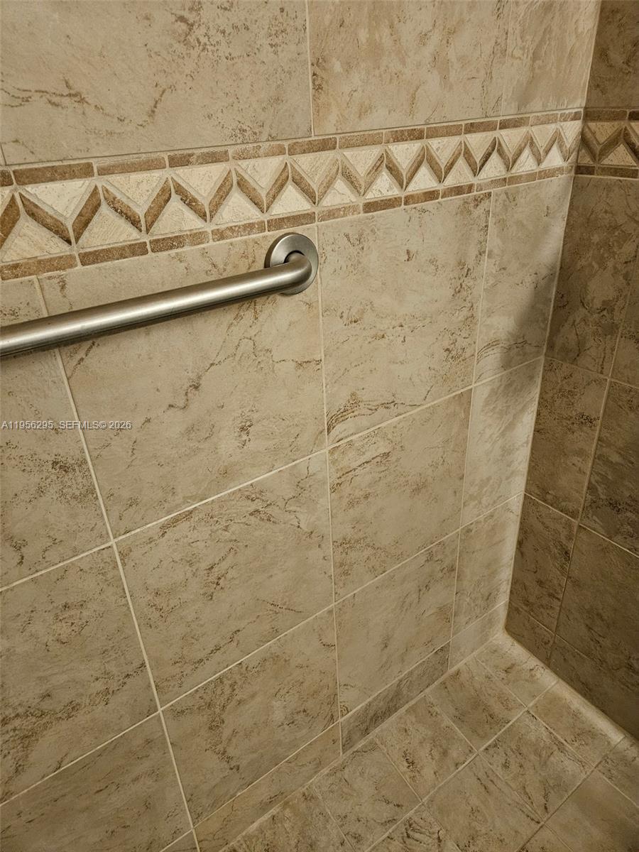 10301 Greenbriar Court Boca Raton, FL 33498 - Photo 17 of 43 a bathroom with a shower