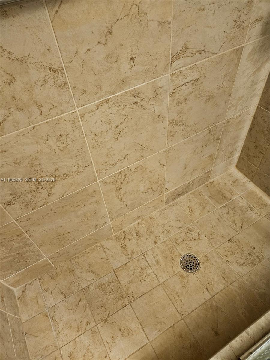10301 Greenbriar Court Boca Raton, FL 33498 - Photo 18 of 43 a bathroom with a shower