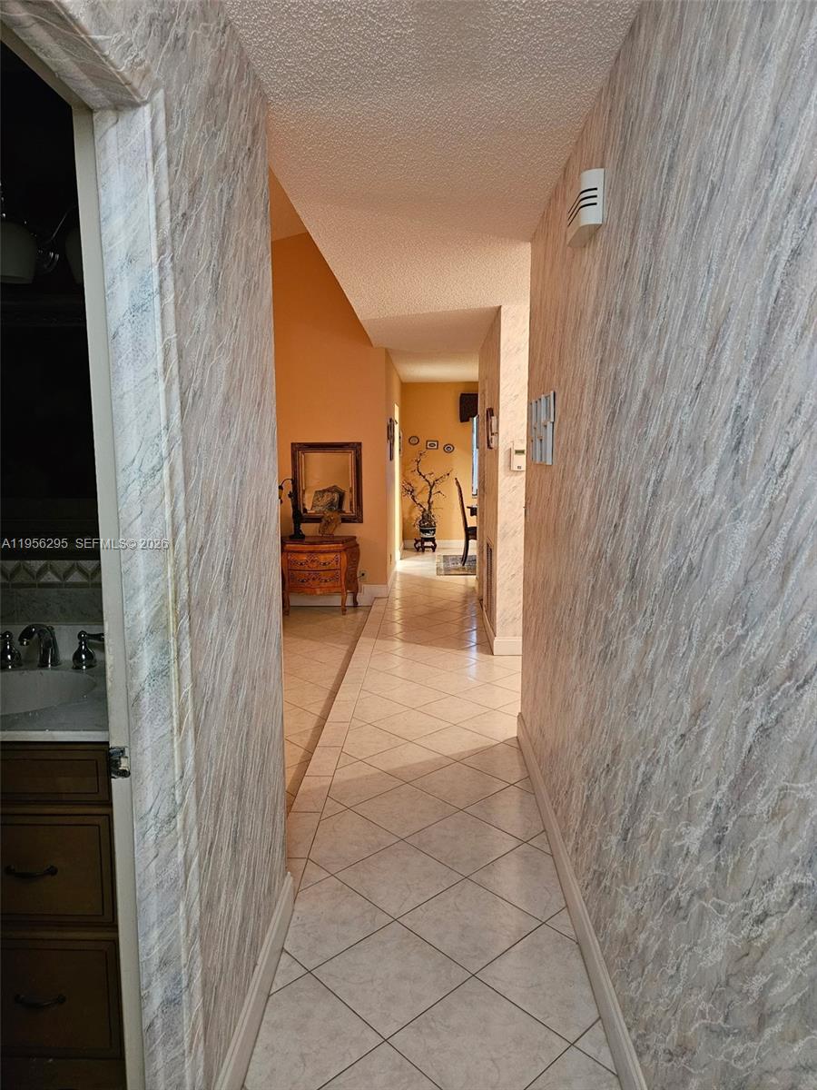 10301 Greenbriar Court Boca Raton, FL 33498 - Photo 25 of 43 a hallway with a furniture