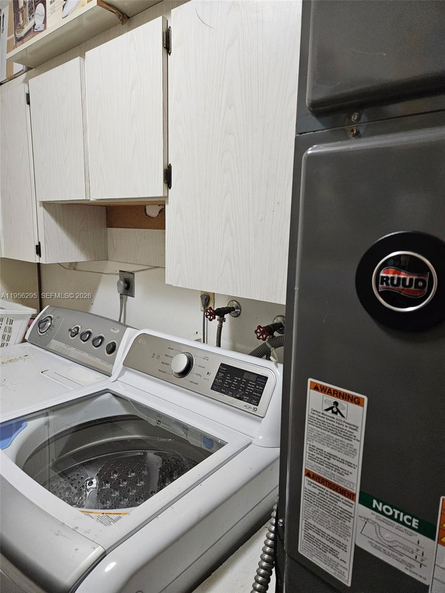 10301 Greenbriar Court Boca Raton, FL 33498 - Photo 35 of 43 a kitchen with a stove and a sink