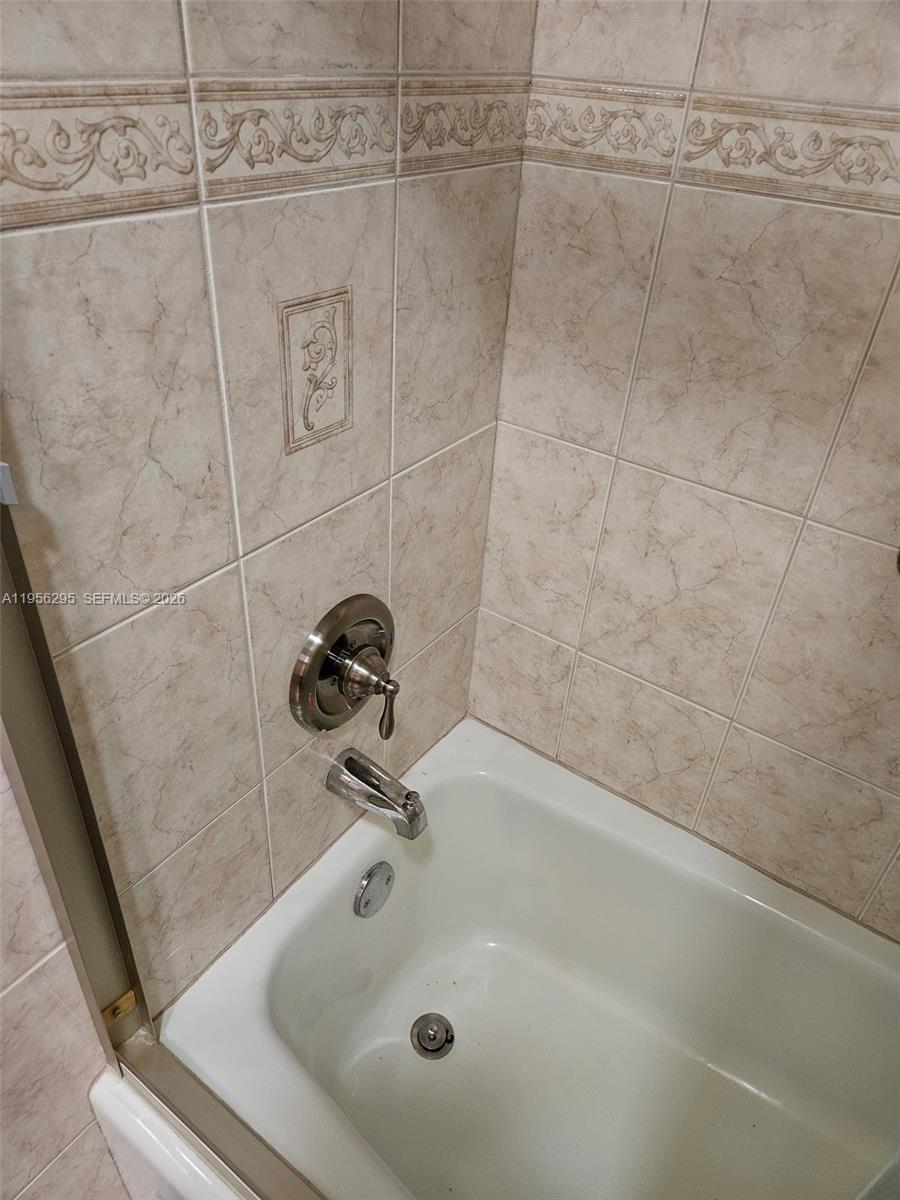 10301 Greenbriar Court Boca Raton, FL 33498 - Photo 38 of 43 a bathroom with a sink