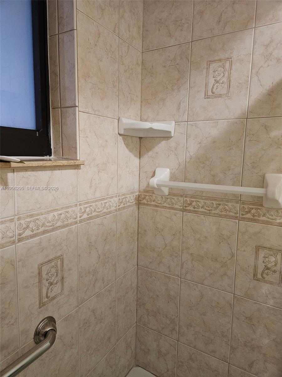 10301 Greenbriar Court Boca Raton, FL 33498 - Photo 39 of 43 a bathroom with a shower