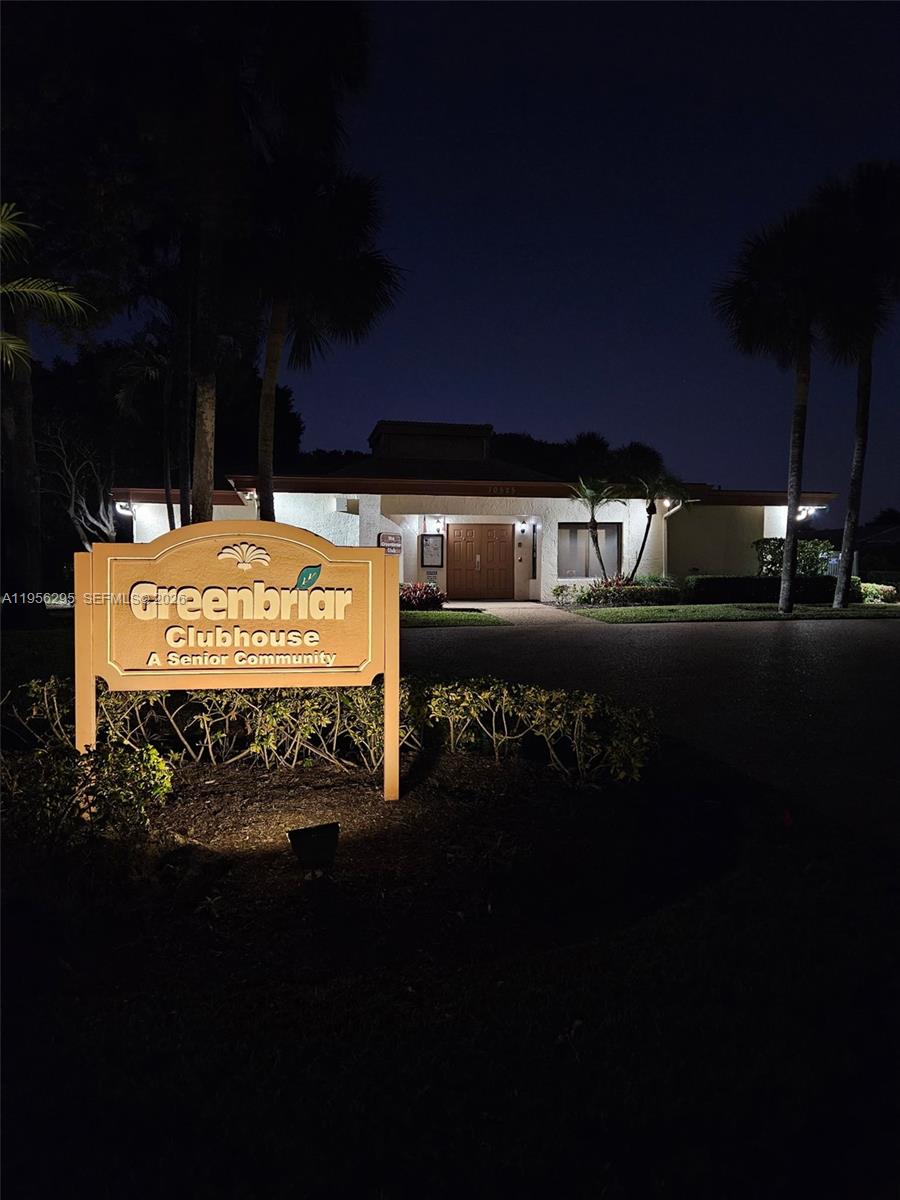 10301 Greenbriar Court Boca Raton, FL 33498 - Photo 43 of 43 a sign on the wall of a building