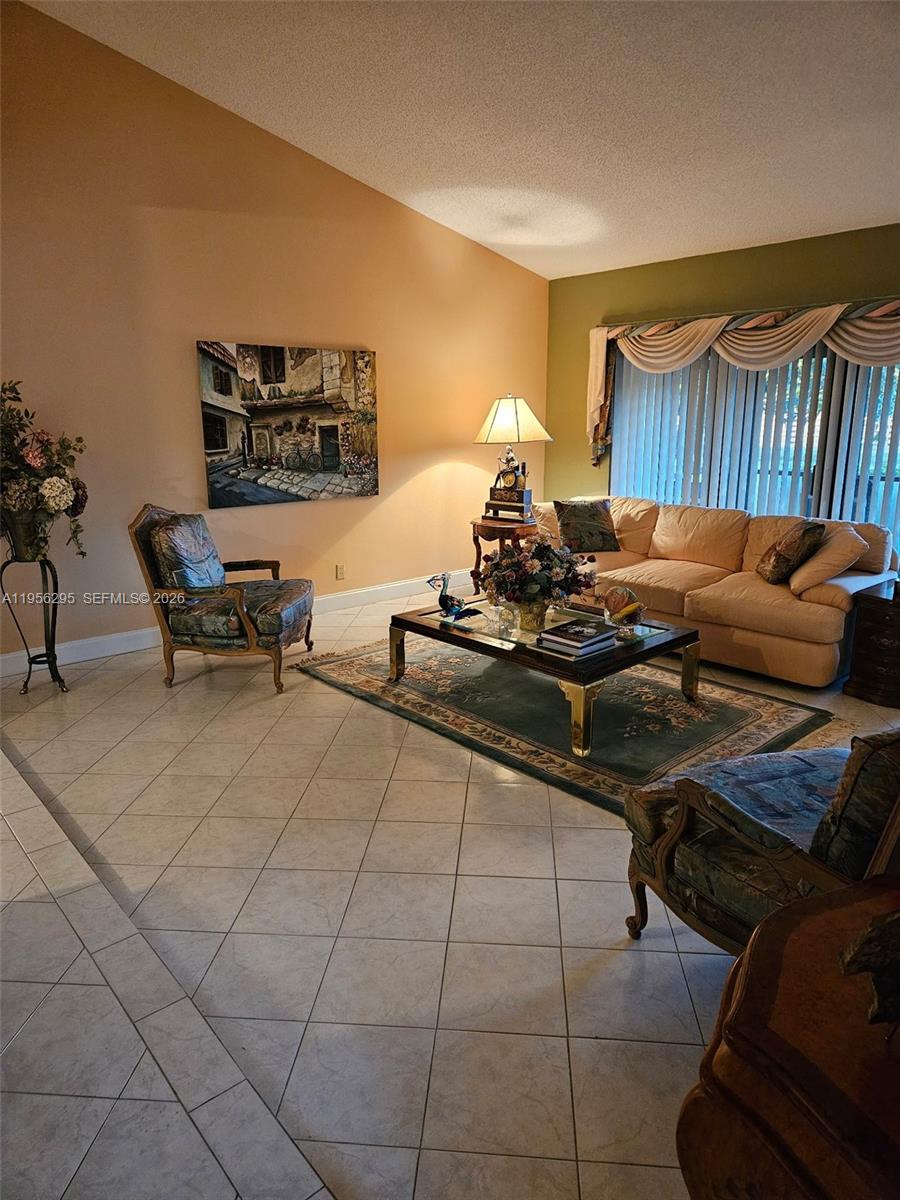 10301 Greenbriar Court Boca Raton, FL 33498 - Photo 7 of 43 a living room with furniture and a couch