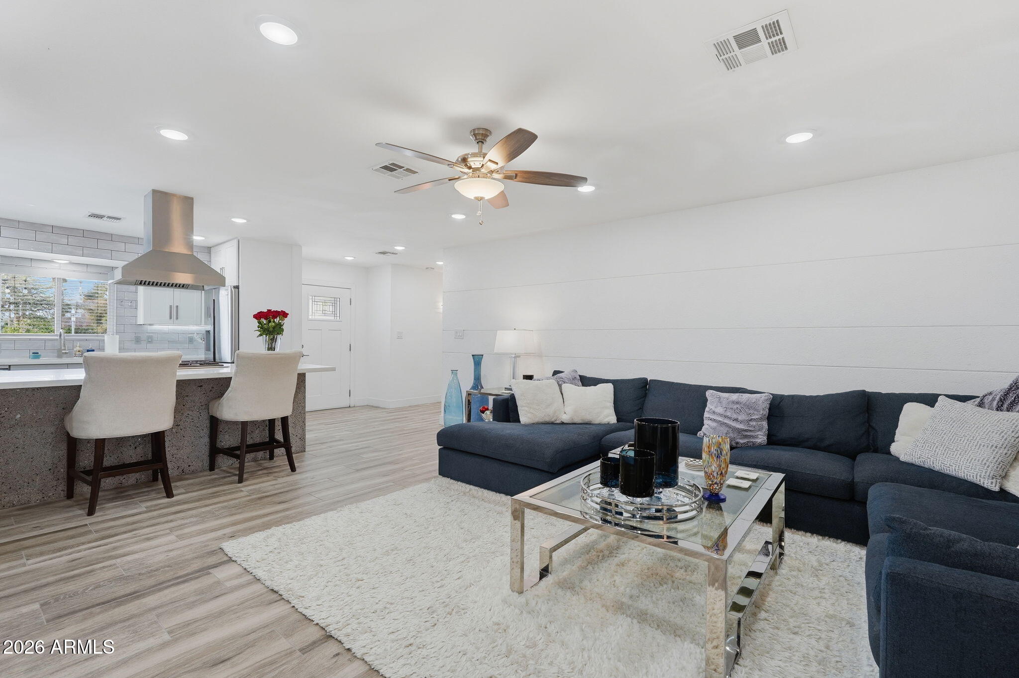 5149 North 34th Street Phoenix, AZ 85018 - Photo 14 of 70 a living room with furniture a chandelier and a table