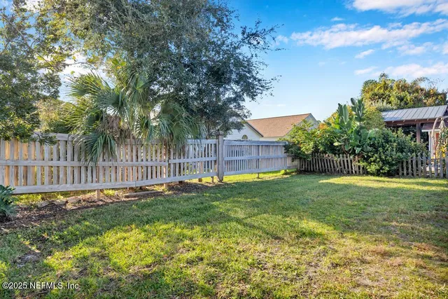 a view of a backyard with a garden and plants