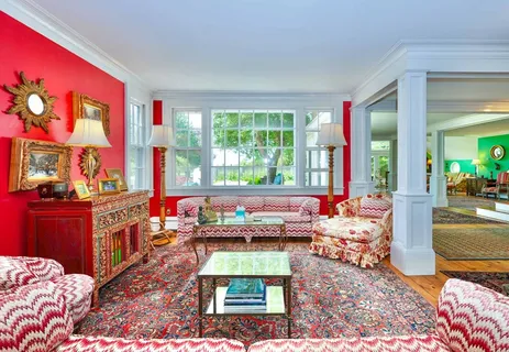 a living room with furniture and a rug