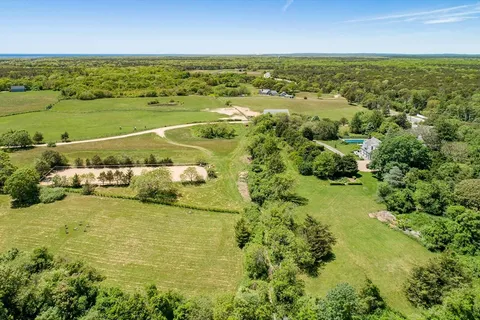 a view of an ocean and a houses