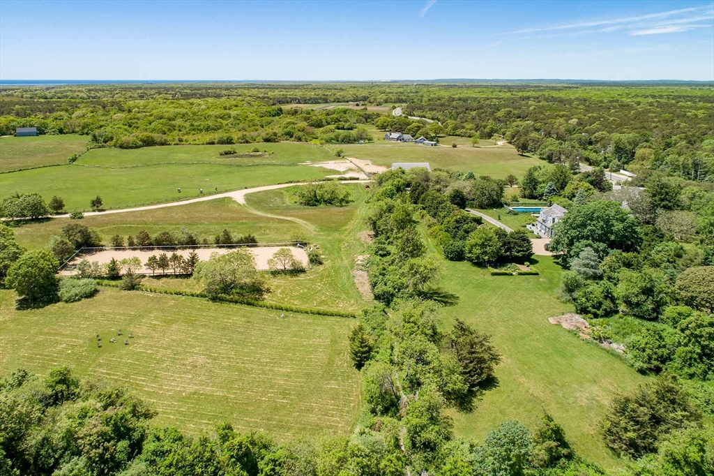 1 Louis Field Road Edgartown, MA 02539 - Photo 7 of 23 a view of an ocean and a houses
