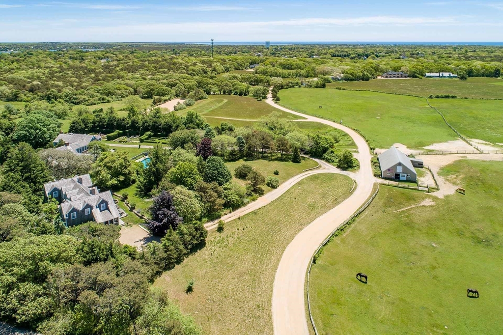 1 Louis Field Road Edgartown, MA 02539 - Photo 10 of 23 a view of a swimming pool from a balcony