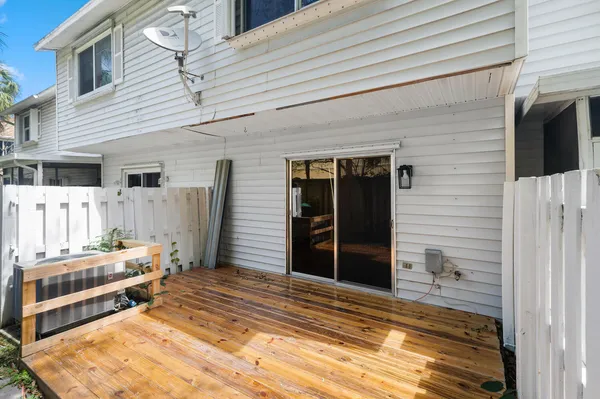 a bedroom with a bed and a view of the house