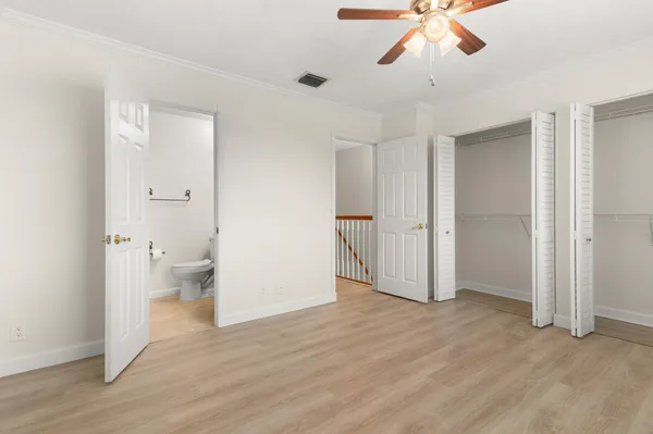 a view of an empty room and a bathroom