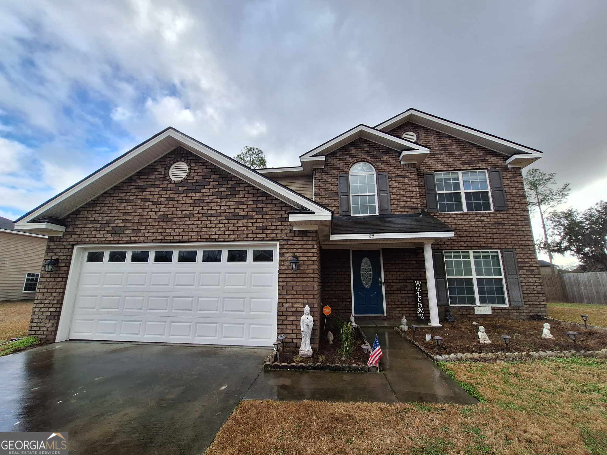 85 Nashview Trail Allenhurst, GA 31301 - Photo 1 of 1 a front view of a house with garden