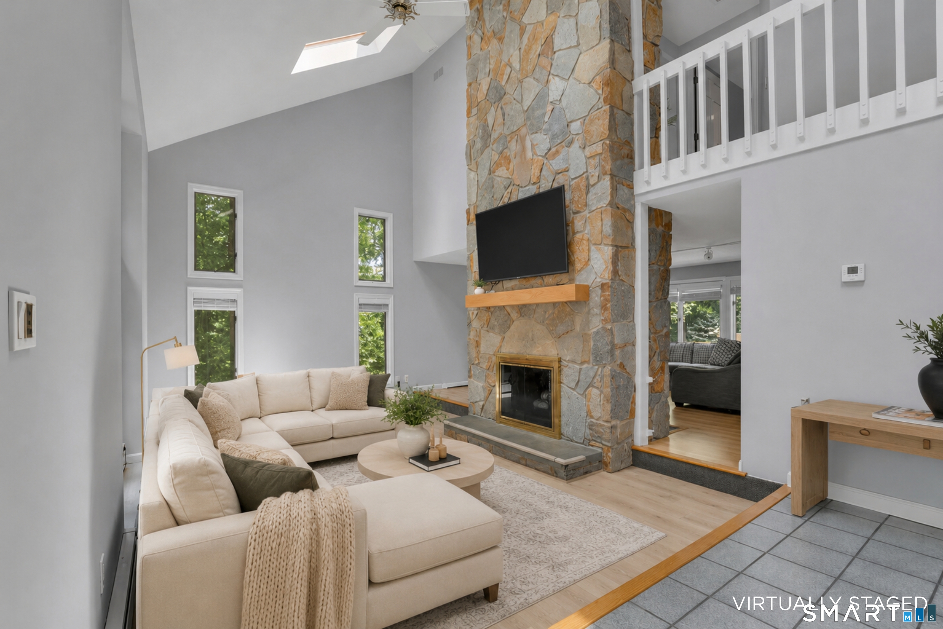 8 Pond View Road Bolton, CT 06043 - Photo 3 of 39 A beautiful entry into the welcoming living room with a 2-sided fireplace.