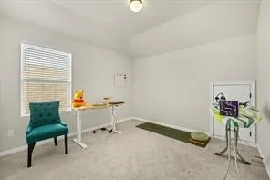 a view of a room with furniture and a window