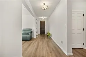 a view of entryway with wooden floor