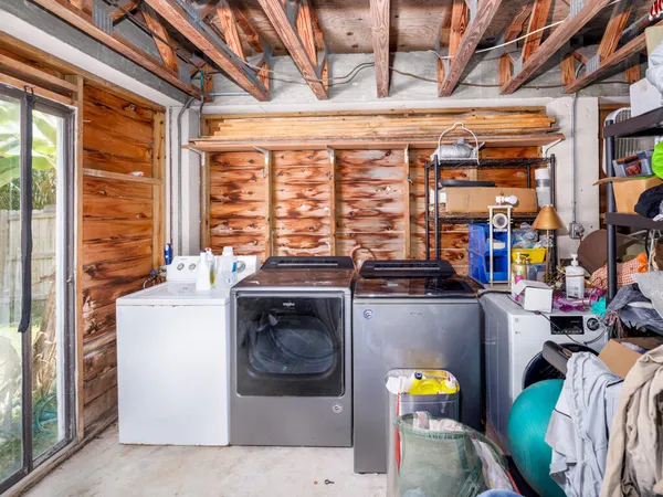 a front view of a house with a yard and a garage